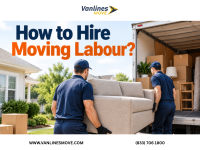 Professional moving labor team carefully loading boxes and furniture onto a moving truck.